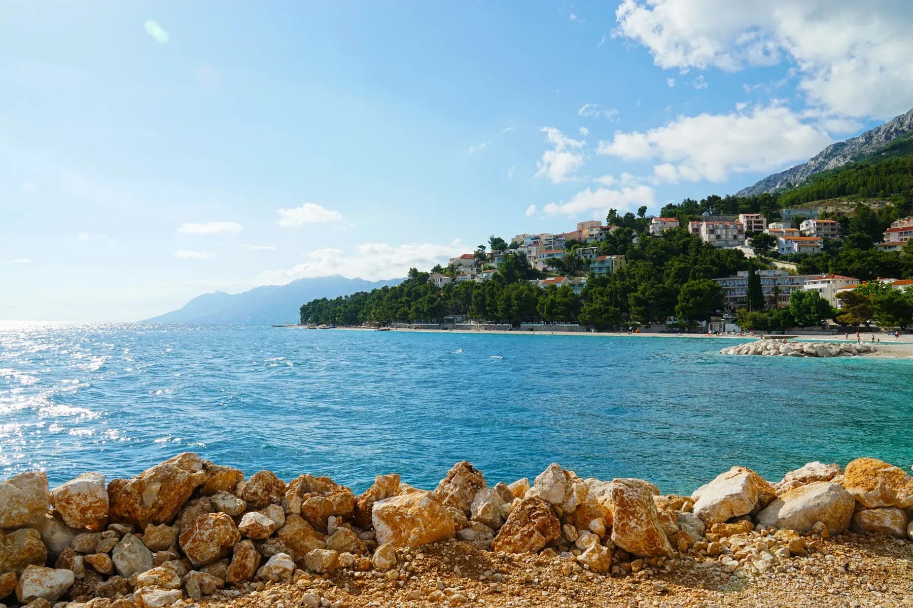 A quiet coastal town beside a calm blue sea